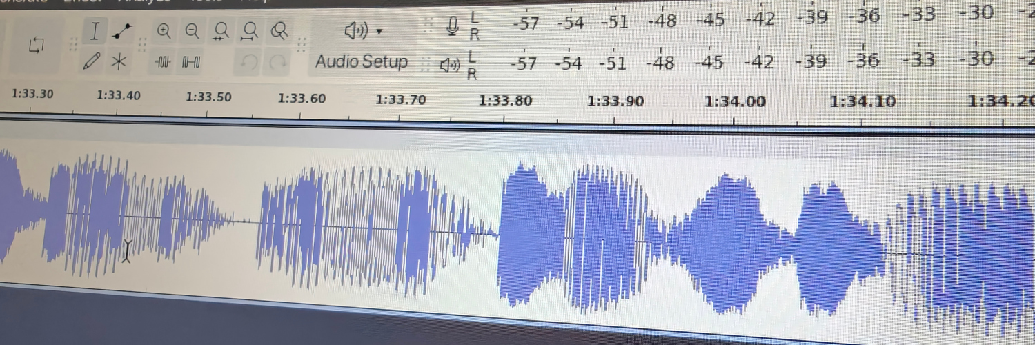 A photograph of a screen showing an audio file being edited in Audacity